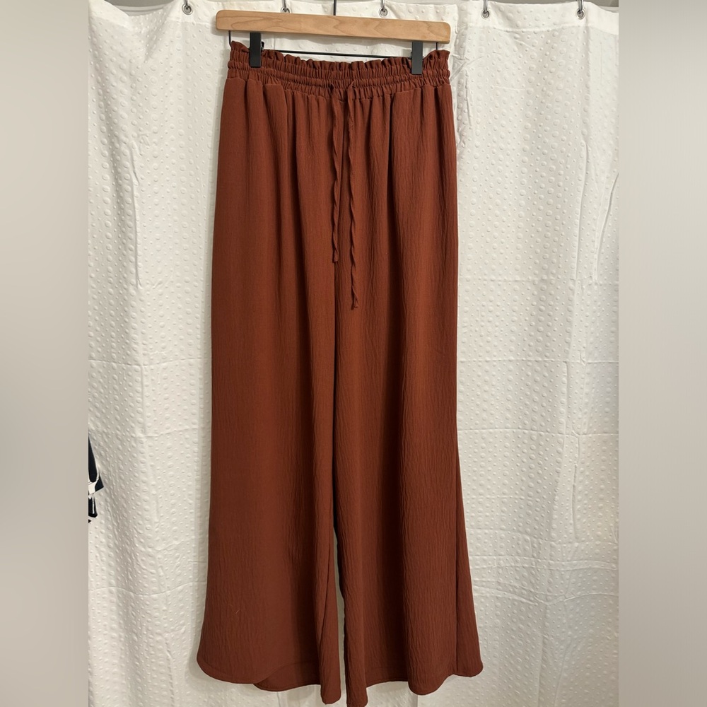 The Black Tape, Burgundy wide leg pant. Size small. Drawstring waist.
